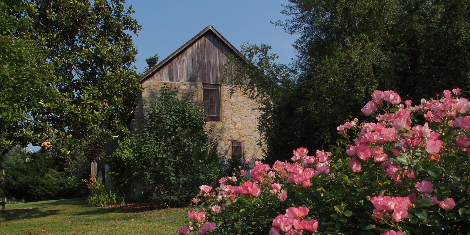 Flowers in from of the barn at Historic Odessa