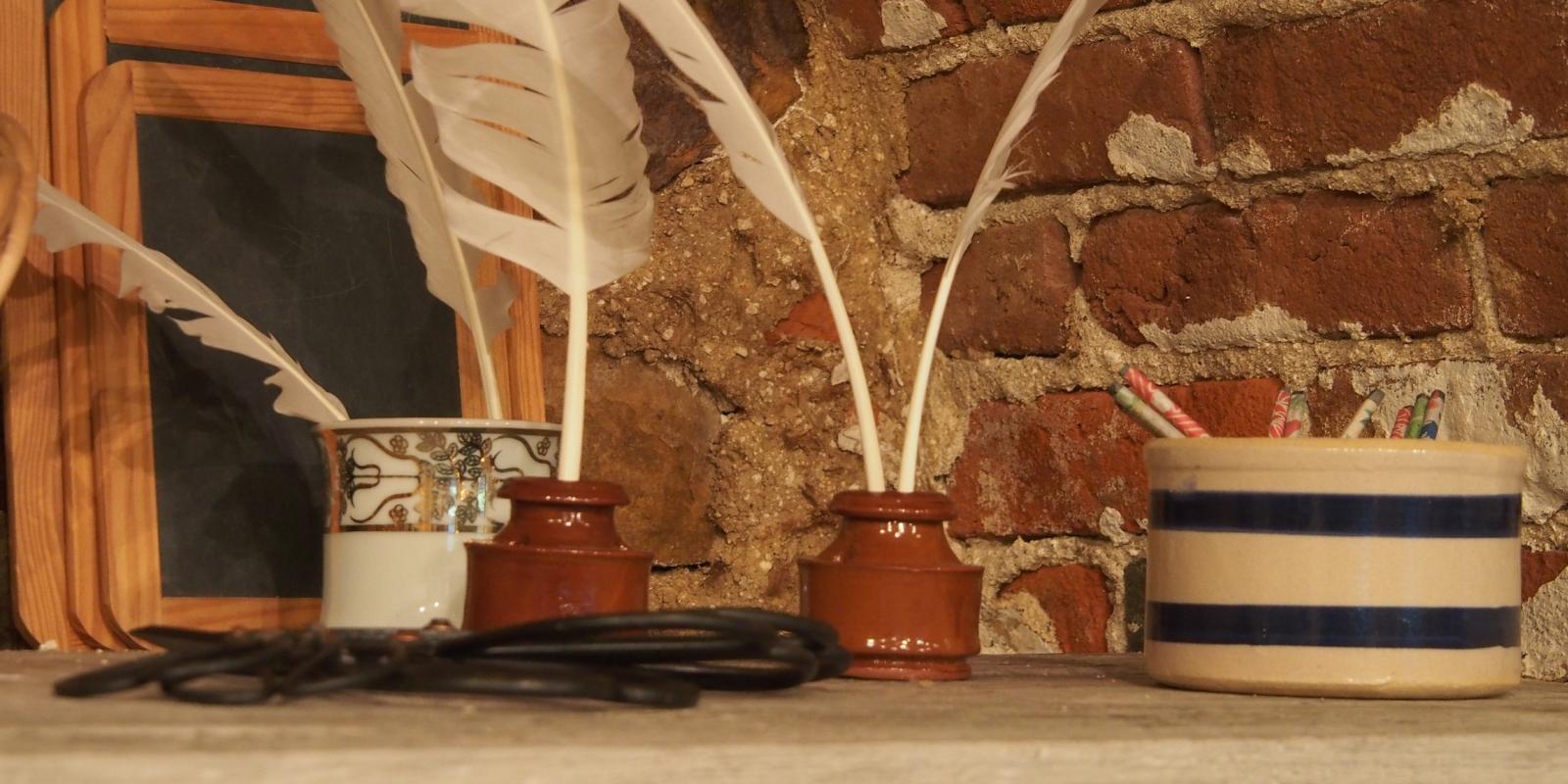 Quill and ink on shelf