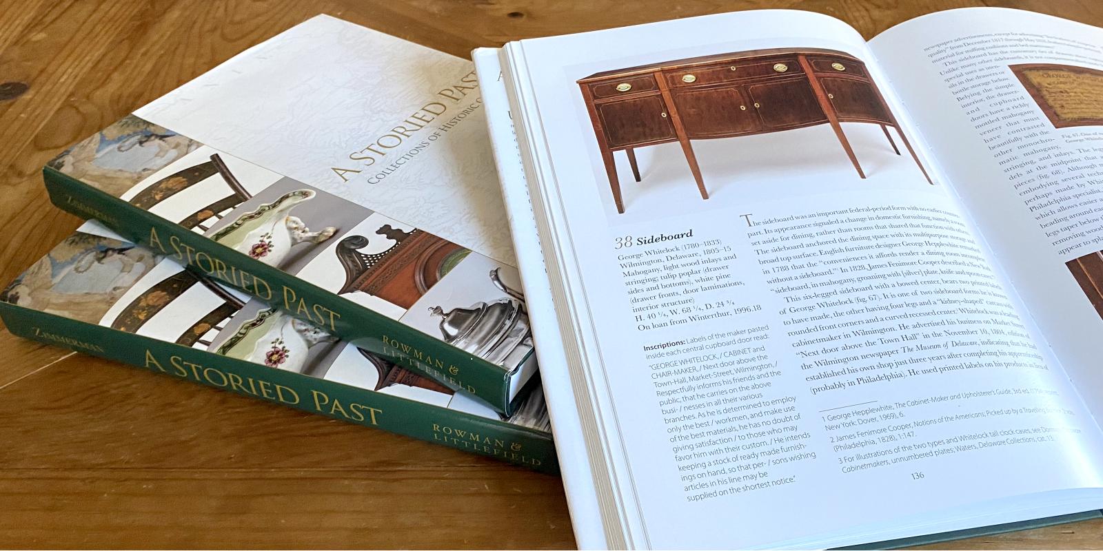 A Storied Past stack of books with one open