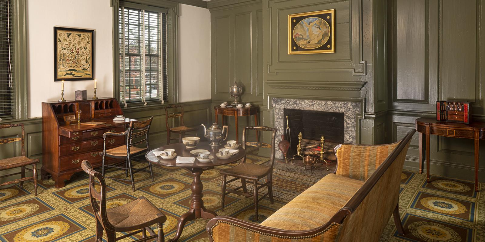 Parlor in the Wilson-Warner house with couch and setting for tea