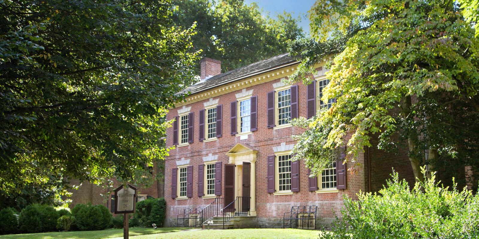 Wilson-Warner House in bright sunlight and trees
